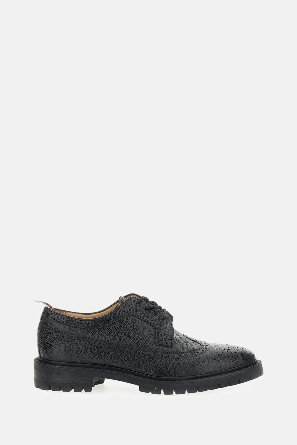 Thom Browne Longwing brogue shoes in hammered leather. $552.24 USD